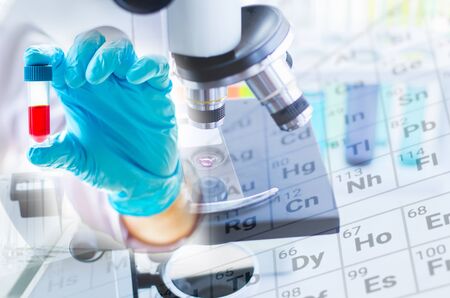 Close-up shot of microscope with metal lens at laboratory. Scientific and healthcare research background.の写真素材