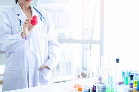 Medical physician doctor woman over laboratory tube blood test and glasswareの写真素材