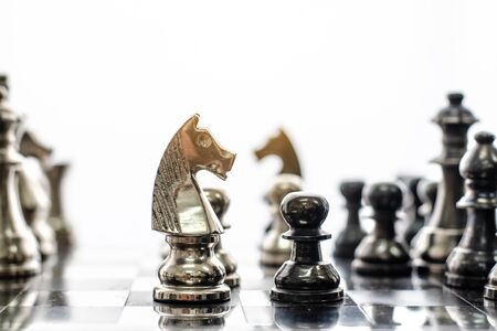 Detail of a hand making the first move in a chess game, moving the pawn one field forward. Selective focusの写真素材