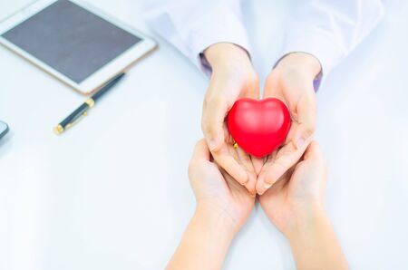 hand of doctor give heart to people  handの写真素材