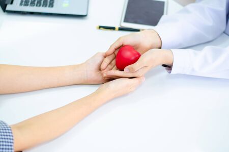 hand of doctor give heart to people  handの写真素材
