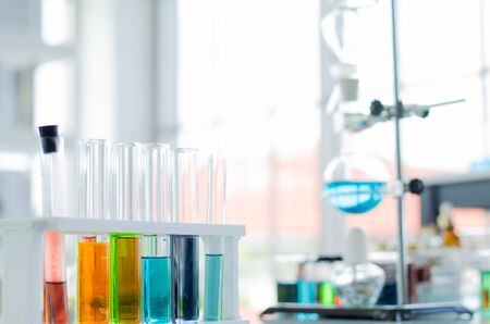 A pipette dropping sample into a test tube,abstract science backgroundの写真素材