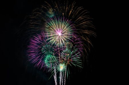 colorful fireworks on the black sky background with free space for text. Celebration and anniversary conceptの写真素材