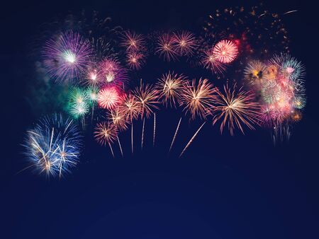 colorful fireworks on the black sky background with free space for text. Celebration and anniversary conceptの写真素材