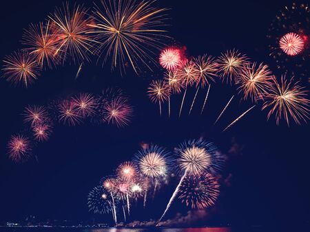 colorful fireworks on the black sky background with free space for text. Celebration and anniversary conceptの写真素材