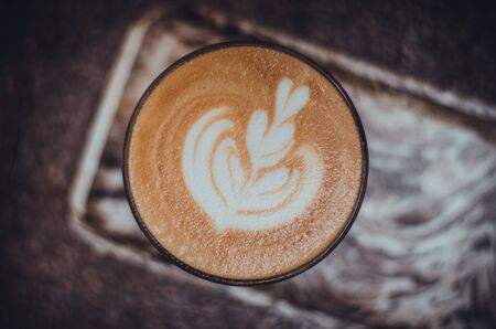 coffee cup on brown wooden background (coffee, top)の写真素材