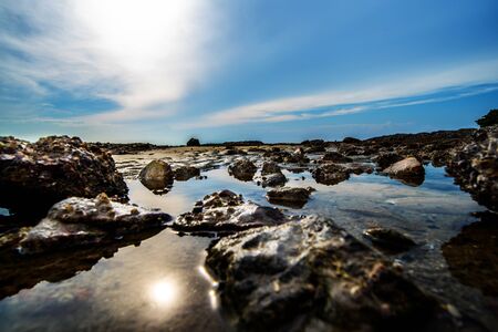 Sea and rock at the sunsetの写真素材