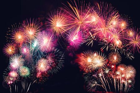 colorful fireworks on the black sky background with free space for text. Celebration and anniversary conceptの写真素材