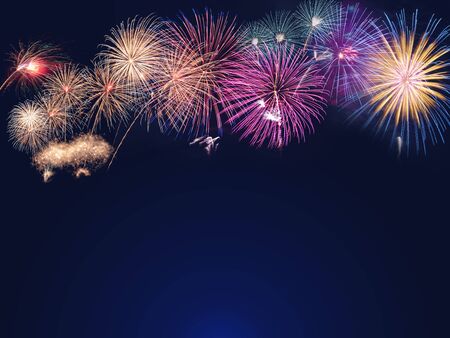 colorful fireworks on the black sky background with free space for text. Celebration and anniversary conceptの写真素材