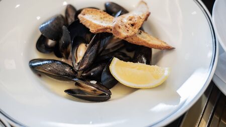 Steamed mussels in white wine sauceの写真素材