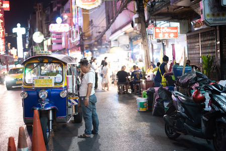 BANGKOK, THAILAND - may 4:Unidentified male driver of Tuk Tuk or 3-wheeled taxi,waiting passenger to trips tour at china town on may 4 2019のeditorial素材