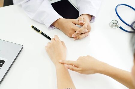 Professional doctor receiving patient in hospitalの写真素材