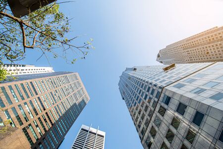 Modern business skyscrapers, high-rise buildings, architecture raising to the sky, sun. Concepts of financial, economics, future etc.の写真素材
