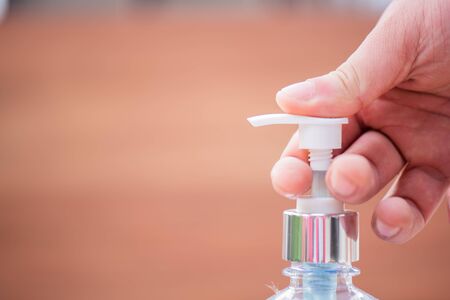 washing hands with alcohol gel after using activity in public space . prevent spread  of corona virusの写真素材