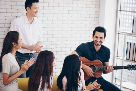 group of team in office , play guitar  looking happy time , relax  from working  timeの写真素材