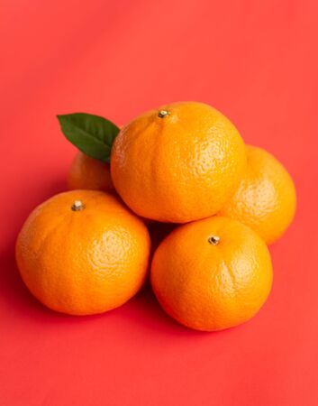 orange on red paper backgroundの写真素材