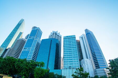 Modern business skyscrapers, high-rise buildings, architecture raising to the sky, sun. Concepts of...