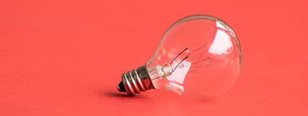 electric light bulb on pink backgroundの写真素材