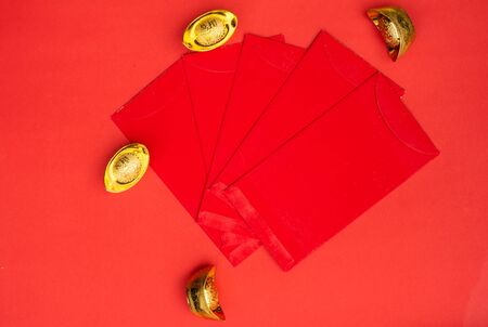 Accessories on Lunar New Year & Chinese New Year vacation concept background.Orange in white plate with red pocket moneyの写真素材