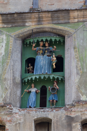 Closeup view of clock tower of Sighisoara castle in Transylvania, Romania, birth place of Vlad Dracul, or Draculaのeditorial素材