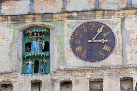 Closeup view of clock tower of Sighisoara castle in Transylvania, Romania, birth place of Vlad Dracul, or Draculaのeditorial素材
