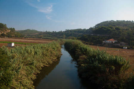 Portugal river with a bridge village in the mountainsの写真素材