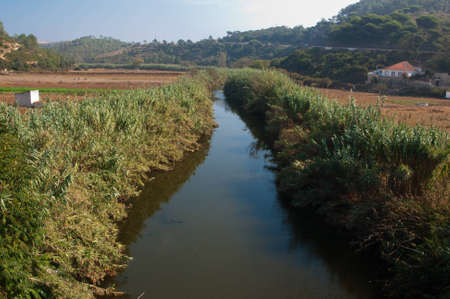 Portugal river with a bridge village in the mountainsの写真素材