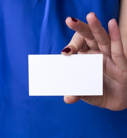 Girl holding business cardの写真素材