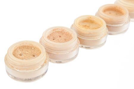 jars with make-up powder, blush, rouge, eyeshadows isolated over whiteの写真素材