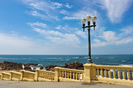 street lamp on a promenade near Atlantic ocean in Porto, Portugalの写真素材