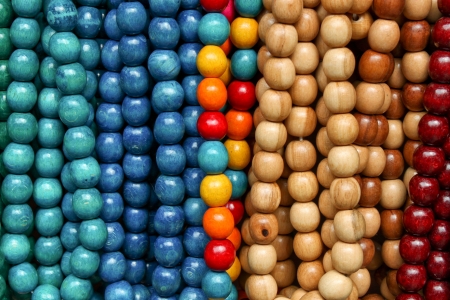 wooden colored beads on display on the market