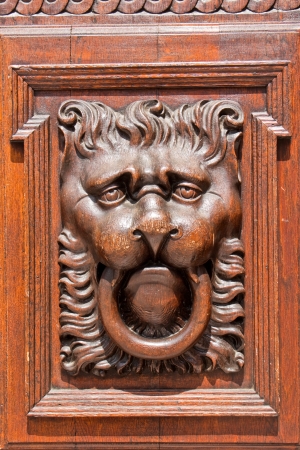wooden lion head as a door knocker in Old Town Hall, Prague, Czech republicの写真素材
