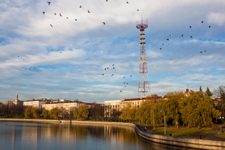 Telecommunication tower and a building where Lee Harvey Oswald lived on the riverside in Minsk, Belarusの写真素材