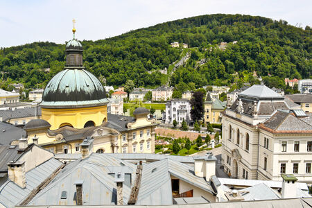 View of The Cajetan Church and The Court of Justice with Kapuzinerberg in the background, Salzburg, Austriaの写真素材