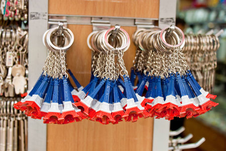 PARIS - SEPTEMBER 21  Key rings shaped as the most famous french landmark, Eiffel tower, in colors of the french flag in a souvenir shop on September 21, 2013 in Paris, France のeditorial素材