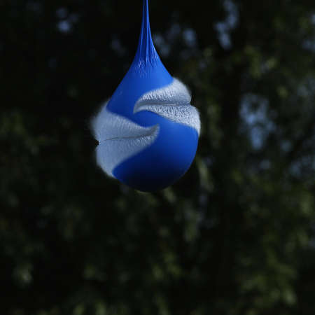 Explosing Blue Balloon with Water inside, Movement sequenceの写真素材