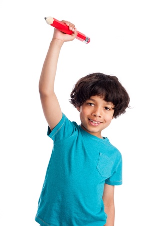 Cute mixed race boy throwing big pencil isolated on white background.の写真素材