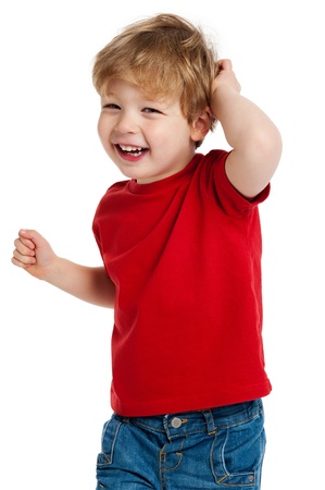 Smiling happy boy in red T shirt shot in the studio on a white background.の写真素材