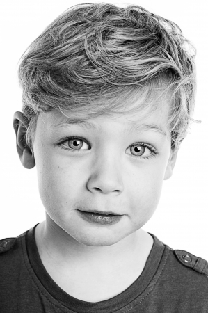 Beautifull black and white portrait of gorgeous young boy.の写真素材