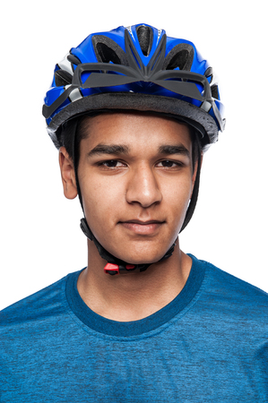 Good looking young man in bike helmet. Studio on white background.の写真素材