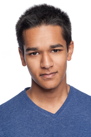 Portrait of a handsome young man looking straight to camera.の写真素材