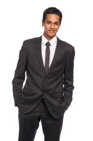 Teenager in impressive smart suit. Ready for job interview. Studio shot on white background.の写真素材