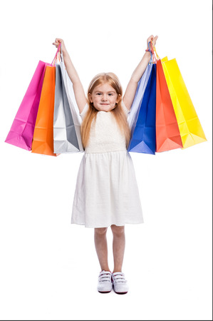 Happy young shopper with lots of shopping.の写真素材