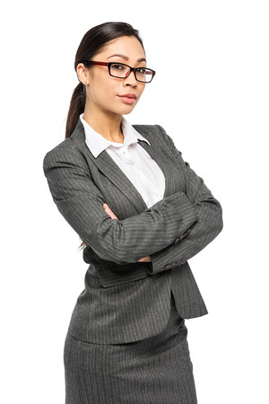 Intelligent looking executive woman in suit and glasses. Studio shot on white background.の写真素材