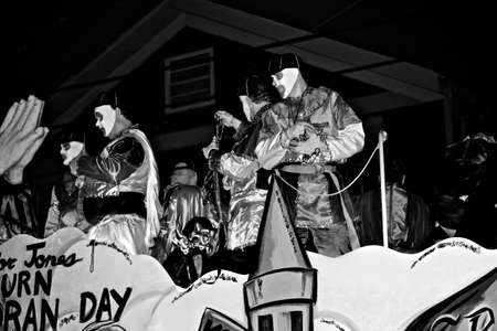a black and white photo of riders with beads on a float during Mardi Gras in New Orleans