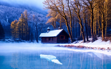 Beautiful winter landscape with wooden house on the lake in the mountainsの素材
