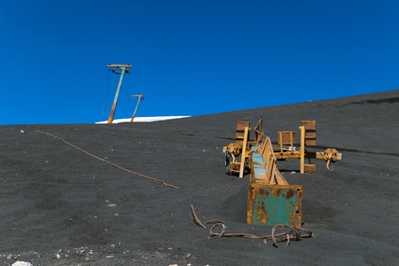 Broken skilift for skiers on the partially snow covered volcano Etna, Lipari, Sicily, Italyの写真素材