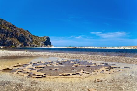 Cliff and seaweeds in sea, Tindari gulf, Sicily, Italyの写真素材