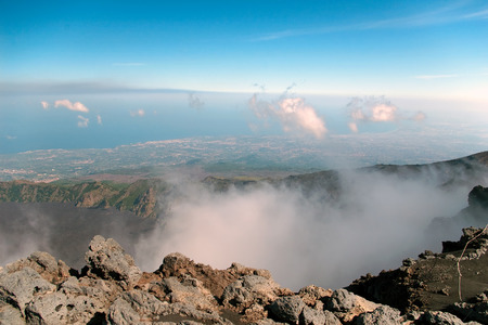 View from mount Etna with sea and towns beneath, Sicily, Italyの写真素材