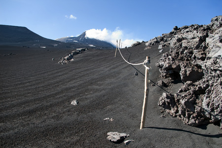 View from mount Etna with sea and towns beneath, Sicily, Italyの写真素材